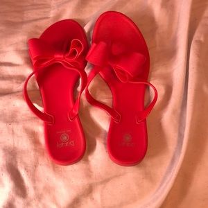 Red bow flip flops